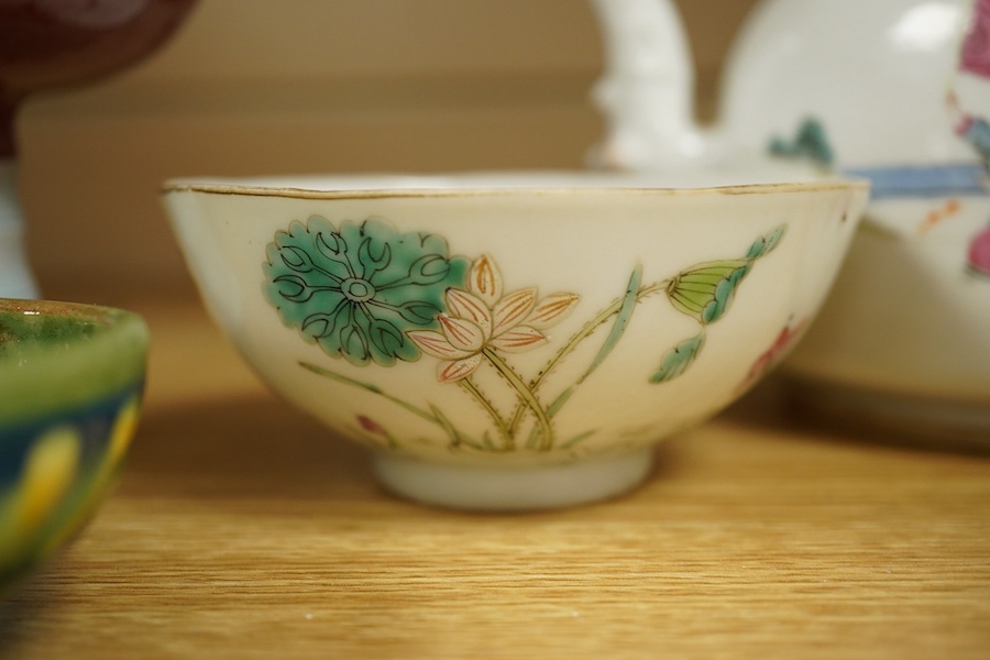 An early 20th century Chinese famille rose teapot, later famille rose teabowl, sang de boeuf stem bowl and two others, tallest 11cm. Condition - varies